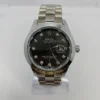 Rolex Oyster Rolex Datejust watch with black dial, diamond hour markers.