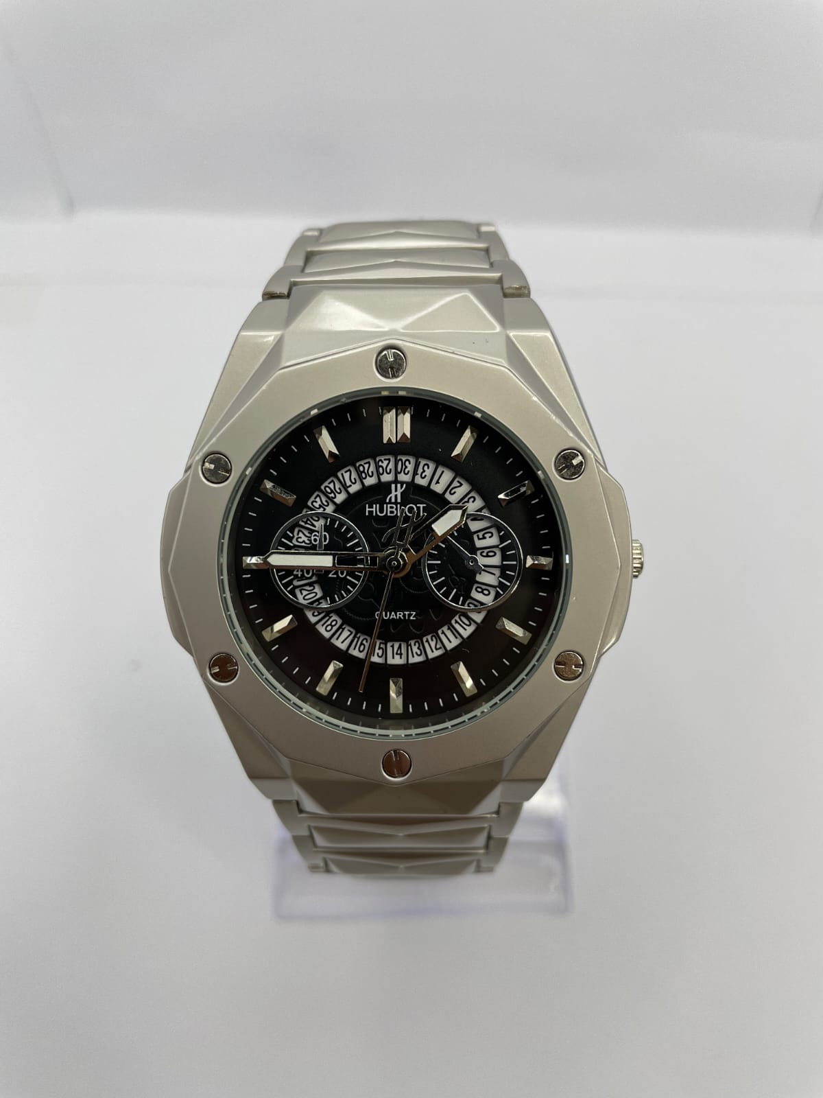 Hublot Diamond Edition quartz men's watch with black multi-dial face, faceted silver case, and stainless steel bracelet – luxury wristwatch close-up.